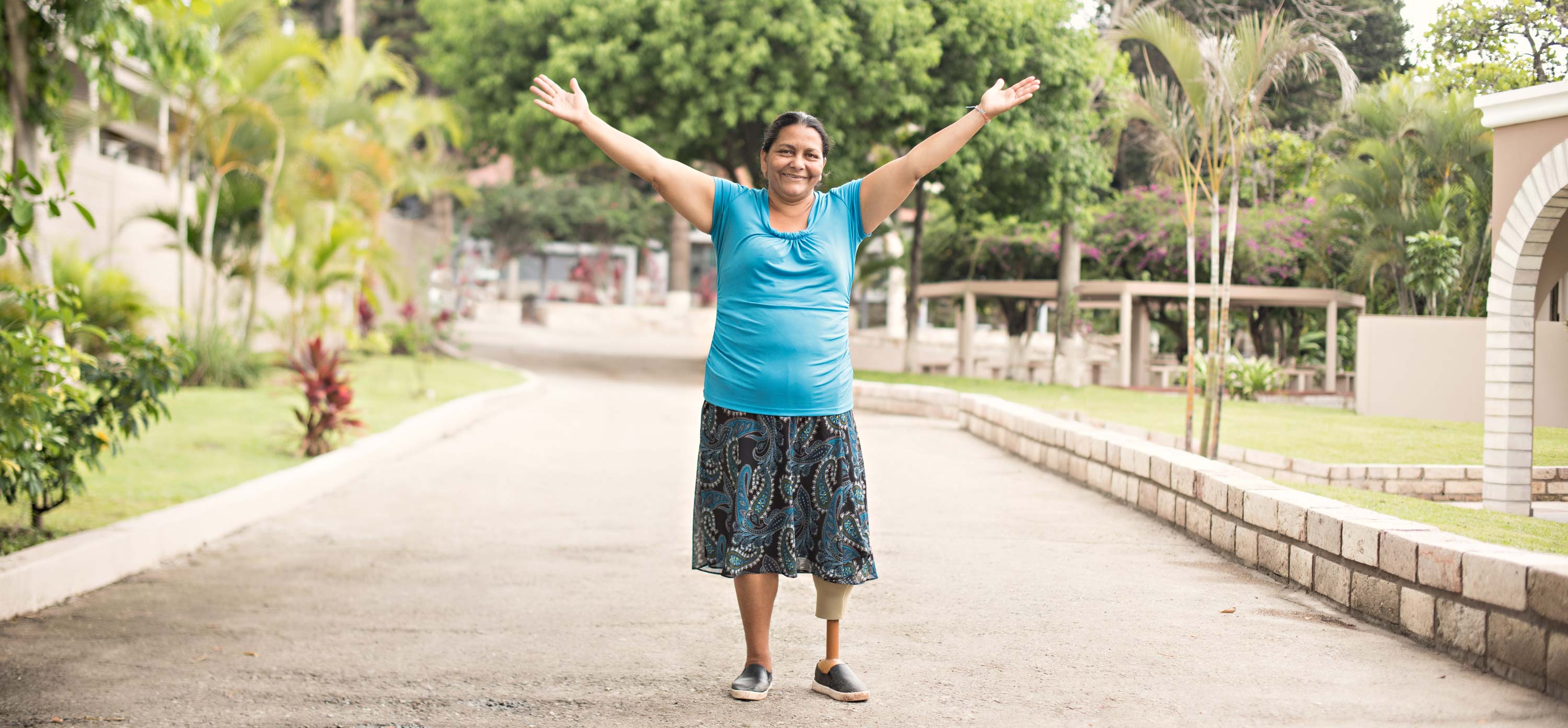 a woman standing with arms outstretched